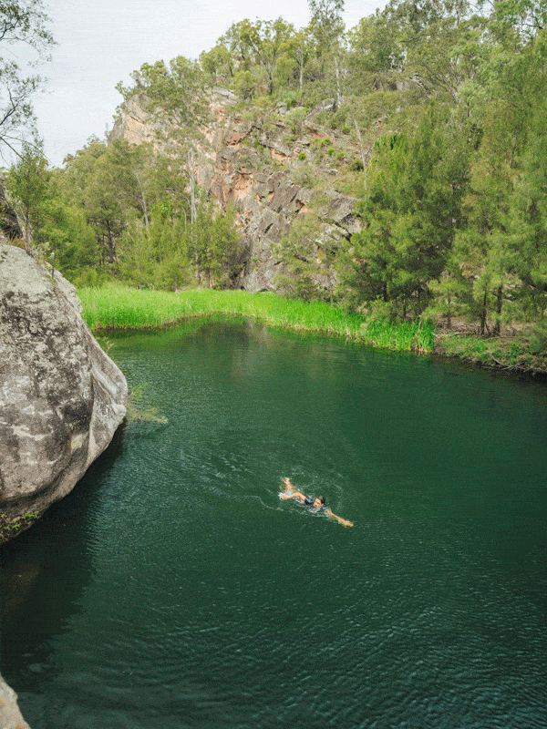 Woman swims in Carnarvon Gorge in Queensland