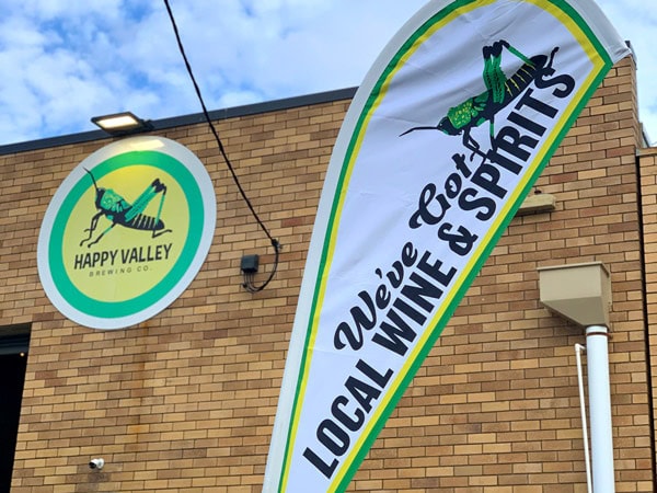 the front signage at the building exterior of Happy Valley Brewing Company