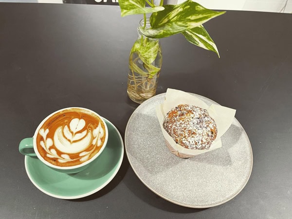 a cup of coffee with a pastry at Pod Espresso