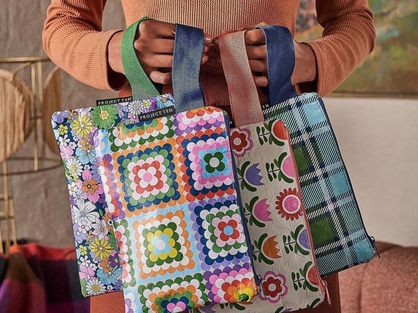 a woman holding gift bags at The Soul Pantry
