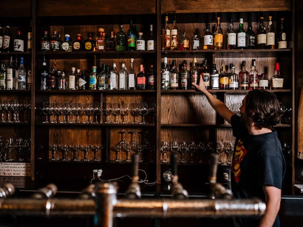 a bartender organising drinks on display at Bar Romantica, Brunswick East