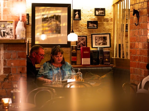 a couple spending an intimate date night at Beneath Driver Lane, Melbourne