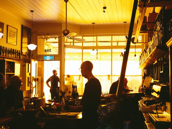 the yellow-coloured interior of Gerald’s Bar, Carlton North