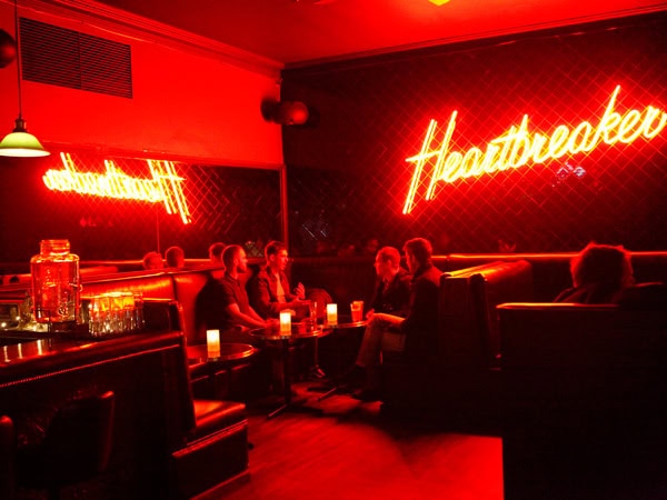 vibrant red neon lighting inside Heartbreaker bar in Melbourne