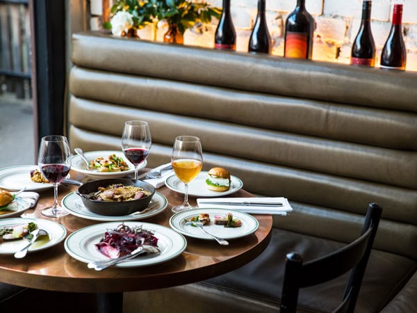 a spread of food and drinks on the table at Marion Wine Bar, Fitzroy