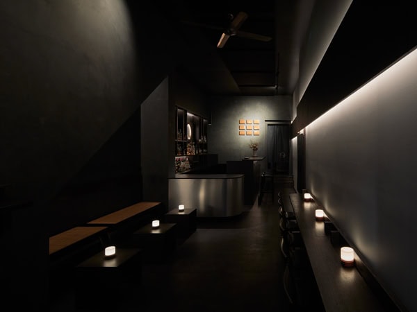 a dimly lit bar interior at One or Two, Melbourne