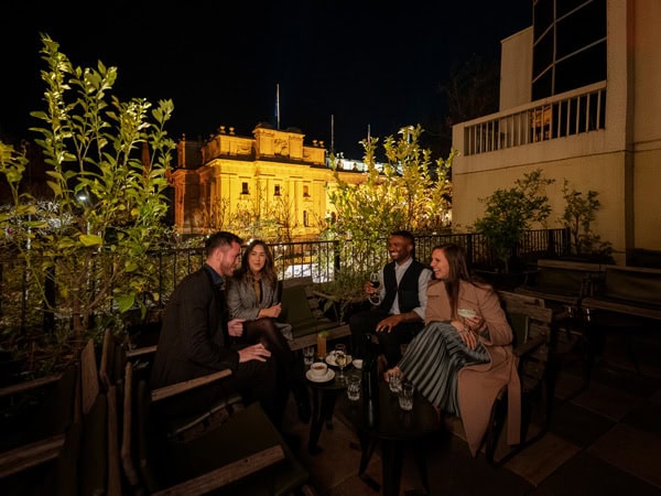 friends enjoying at the Siglo rooftop bar in Melbourne, CBD