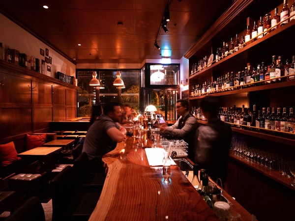 a dimly lit bar setting at The Elysian Whisky Bar, Fitzroy