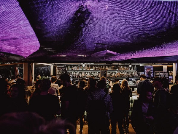 a dimly lit bar with purple ceiling at Whitehart Lane, Melbourne