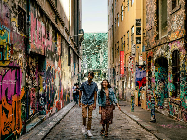 a couple admiring street art along Hosier Lane