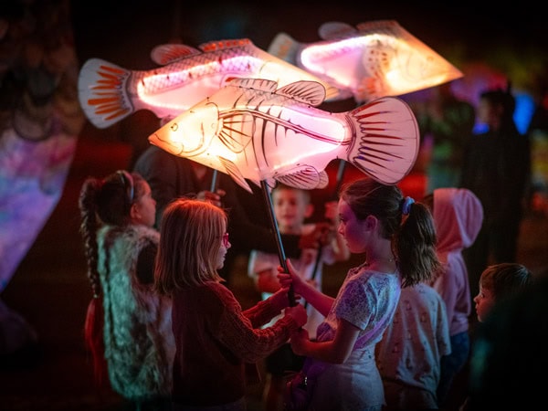 Children play with the props as part of the Arelhe Urrperle installation