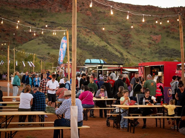 People gather at the food trucks during Parrtjima 2024