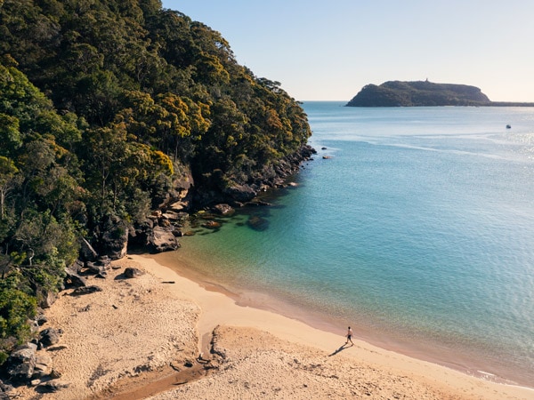 a man enjoying his morning walk along Resolute Beach, Ku-ring-gai Chase National Park