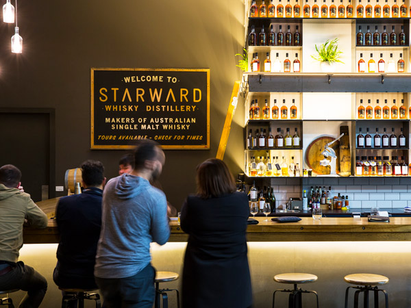 people sitting and drinking inside Starward Distillery