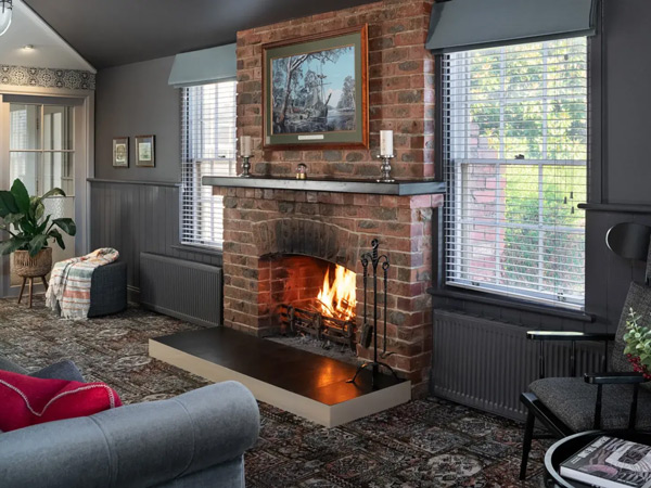 a living room with a fireplace at Sovereign Hill Hotel, Ballarat