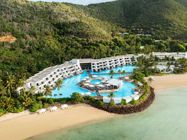 an aerial view of InterContinental Hayman Great Barrier Reef with a pool next to the beach
