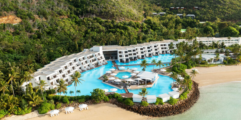 an aerial view of InterContinental Hayman Great Barrier Reef with a pool next to the beach