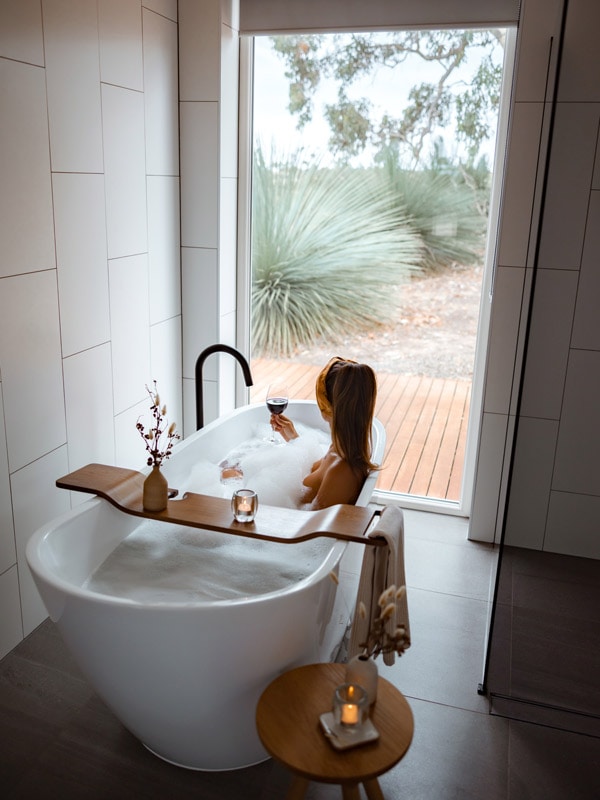 Woman bathes at Ecopia Retreat.