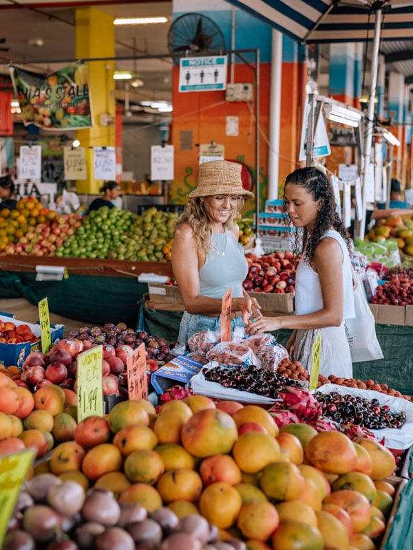 two women buying fresh fruits at Rusty's Market