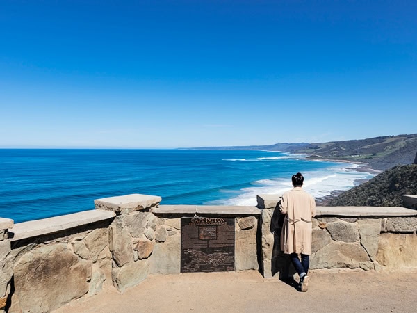 a woman admiring views at Cape Patton