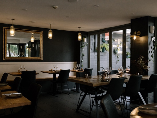 a dimly lit dining space at Elementa restaurant, Newcastle