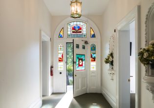 The front door with stain glass windows at The Florance.