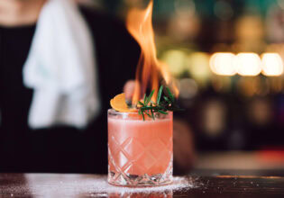 Bartender at Rhonda's in Terrigal making the Burn Baby cocktail