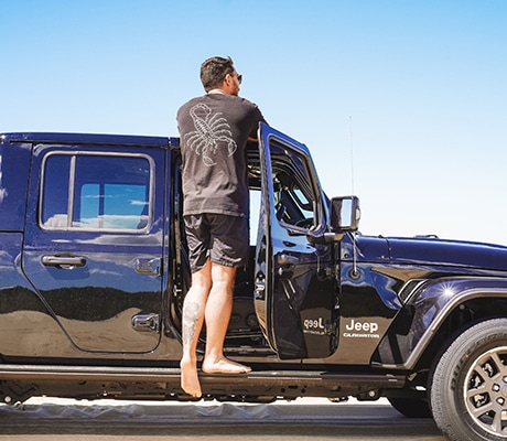 Man standing in Jeep, Stockton Bright Dunes