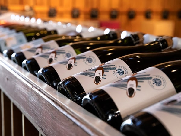 a stack of wine bottles inside Burnbrae Wines, Mudgee