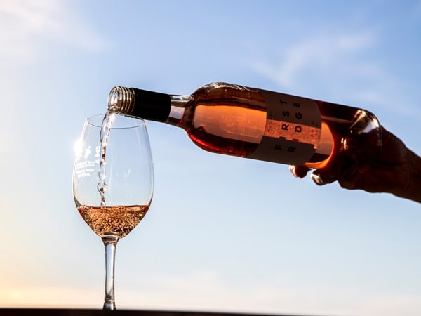 pouring a bottle of wine into the glass