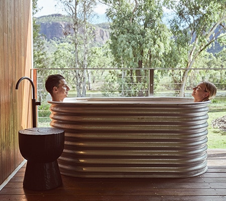 Couple in bath at Mt Mulligan Lodge, QLD