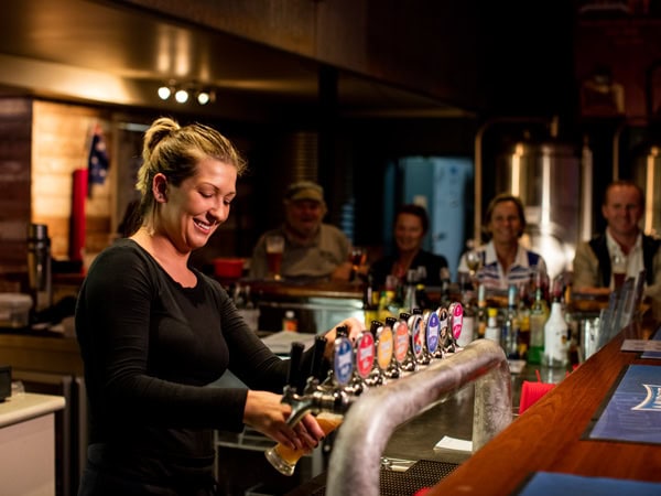a bartender pouring beers at Mudgee Brewing Co.