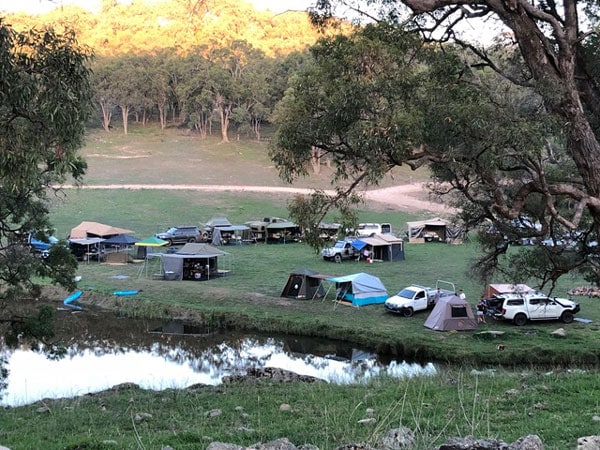 tents set up by the side of the river at Old Bara Campground