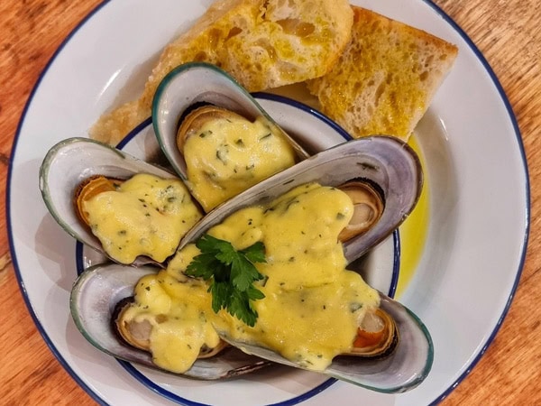 cheesy baked mussels on a plate at Smokin Bro & Co., Mudgee