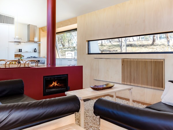 the living room interior of Strikes Mudgee with a fireplace