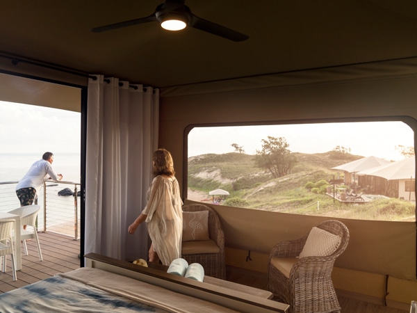 a couple staying in a luxe safari tent at Banubanu Beach Retreat, Northern Territory