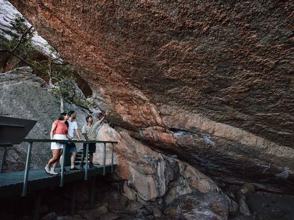 a group of travellers on a guided tour at Nourlangie Rock Art, Kakadu