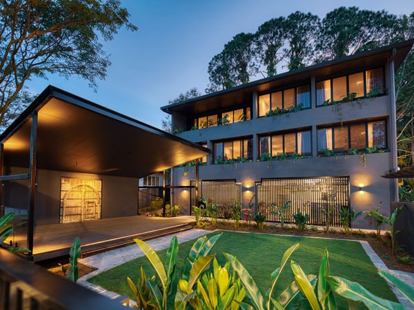 a well-lit courtyard and pavillion in HOLA