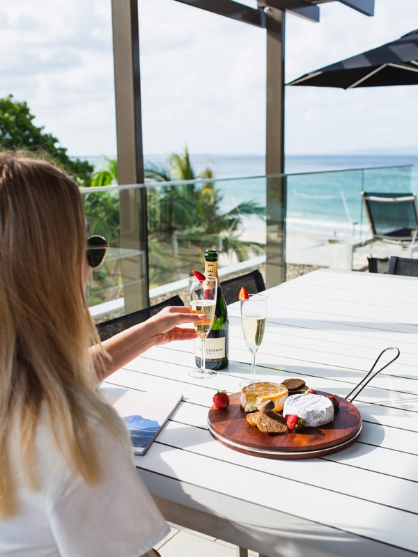 a woman enjoying her meal at Seahaven Noosa Resort & Apartments