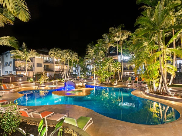 the pool at Mantra French Quarter Noosa at night