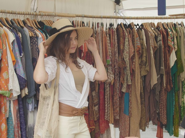 a lady wearing a hat at Orange Grove Organic Food Markets