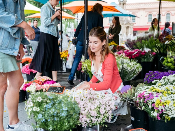 a lady looking at beautiful flowers, Sydney Flower Market