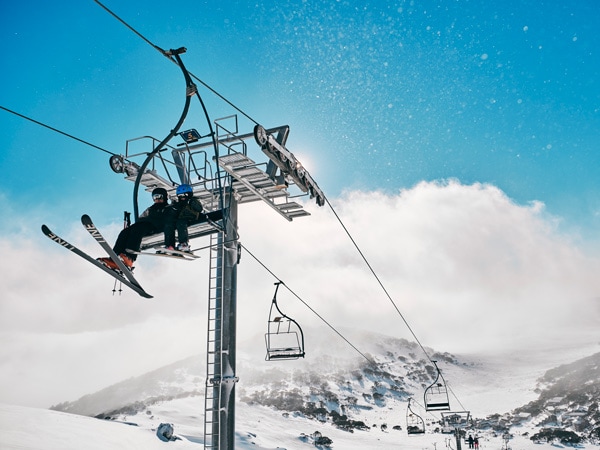 skiers riding the chair lifts at Charlotte Pass Ski Resort in the Snowy Mountains