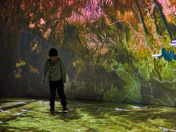 a kid exploring an interactive exhibit at Snowy Hydro Discovery Centre