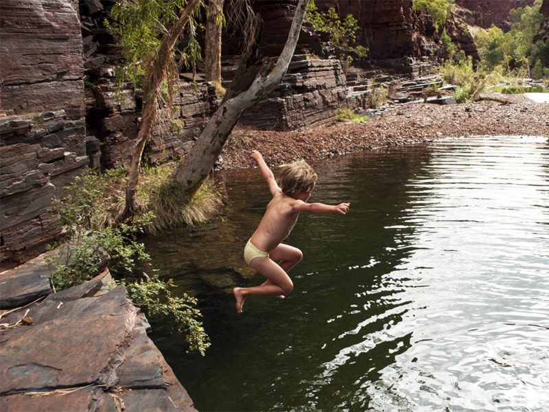 Kid jumps into Karijini National Park gorge