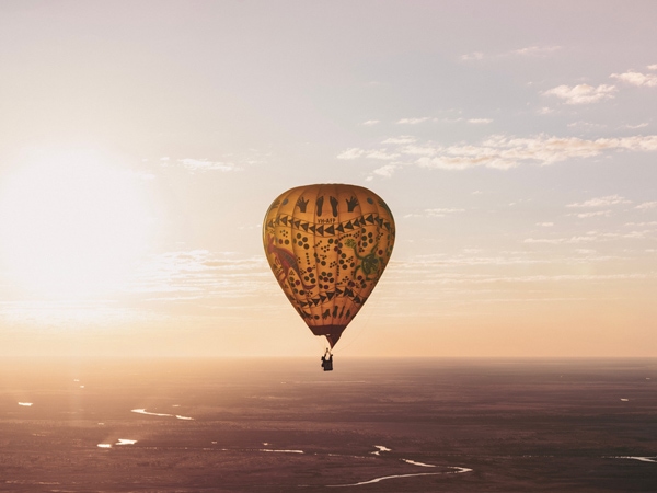 a hot air balloon floating above Burketown, Yagurli Tours