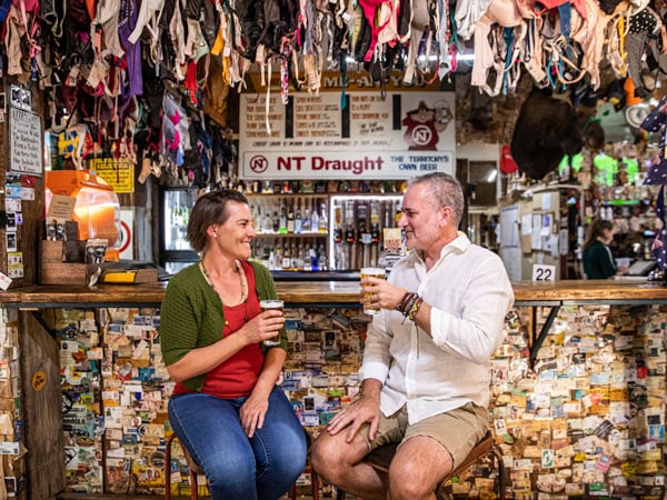 a couple enjoying a drink at Daly Waters Pub