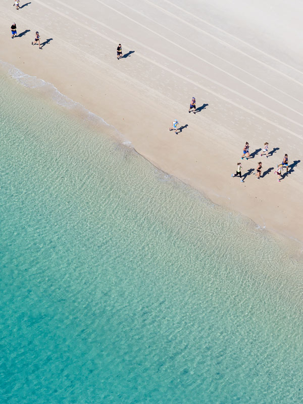 Aerial view of the Hamilton Island Hilly Half Marathon on Whitehaven Beach in Queensland. (Image: Tourism Whitsundays)