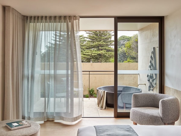 the interior of Hotel Sorrento with an outdoor marble bathtub