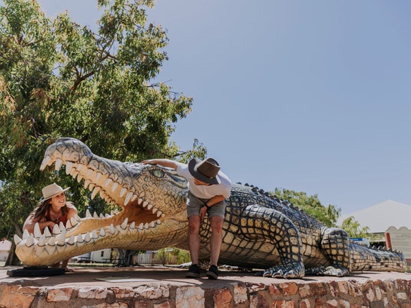 a man posing beside Krys the Crocodile